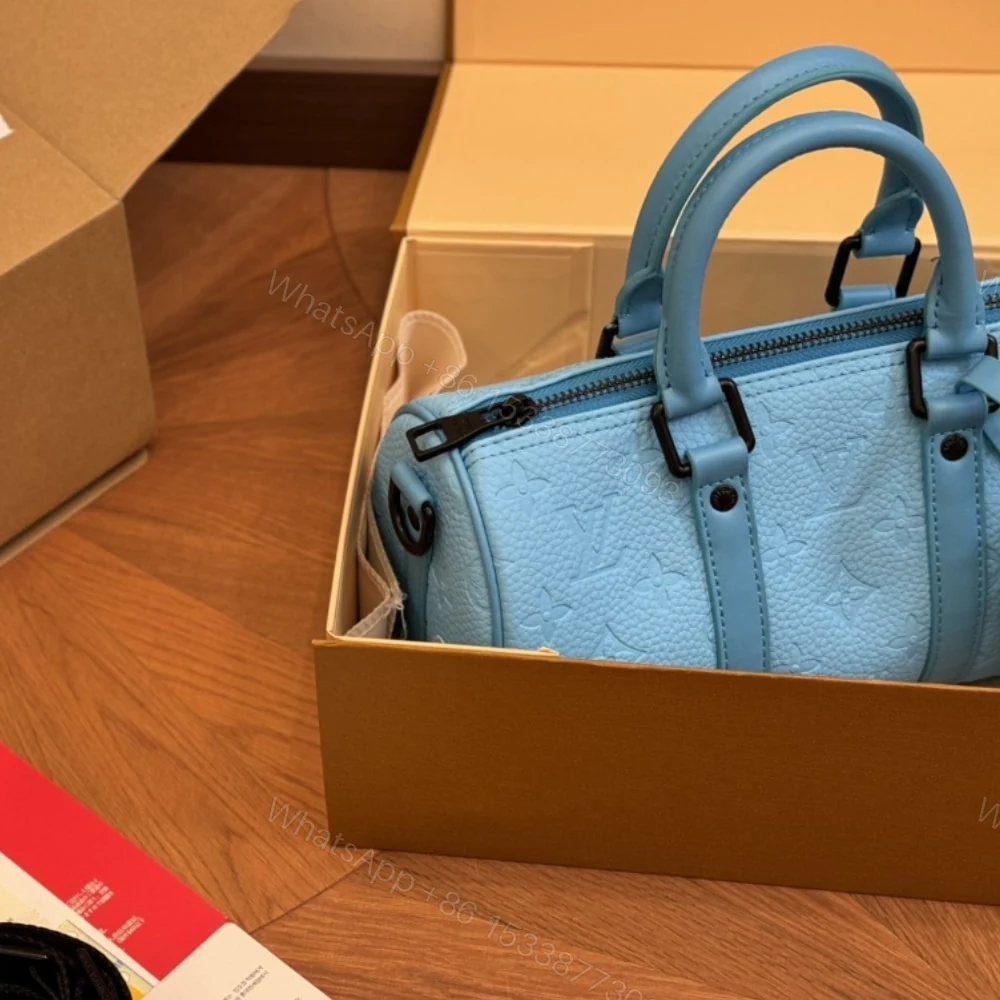 View 6 of Louis Vuitton Keepall Bandoulière 25 Turquoise 25Cm M11996