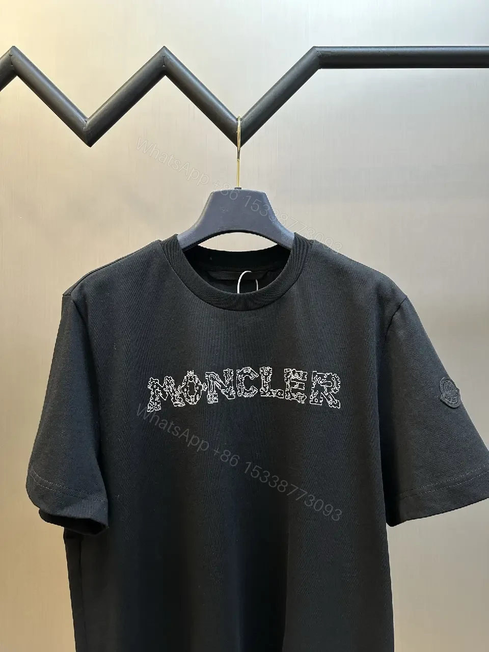 View 11 of Textured Logo Black Tee with Subtle Hardware - Premium Cotton Blend