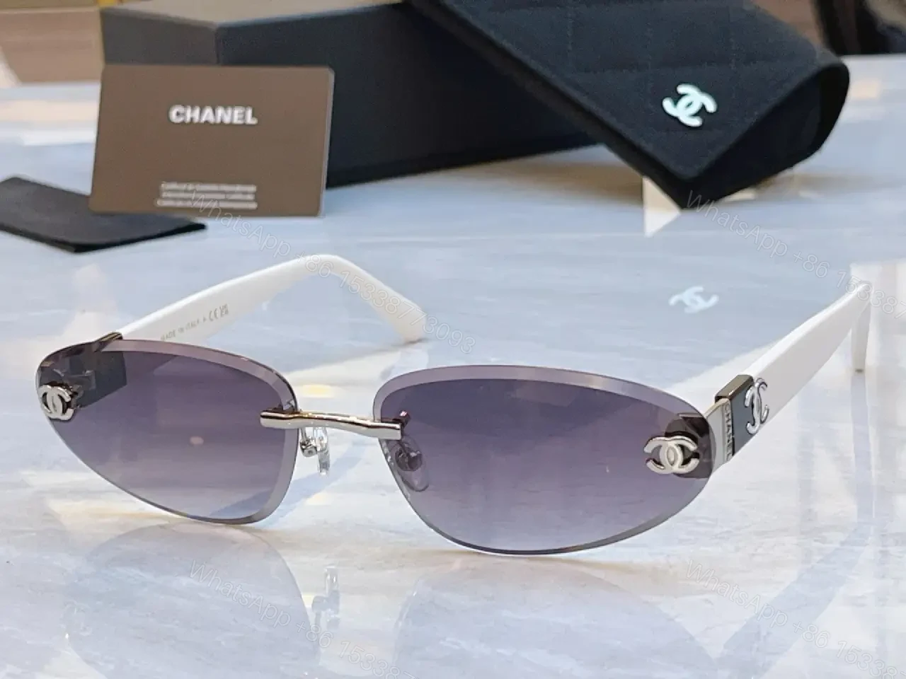 View 6 of Luxurious Silver-Gray Sunglasses: Gold Accents, Semi-Rimless Oval, Chanel Hardware