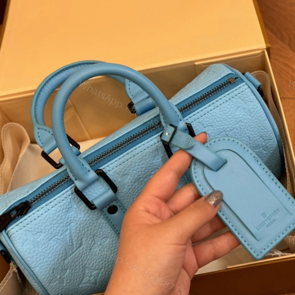 View 3 of Louis Vuitton Keepall Bandoulière 25 Turquoise 25Cm M11996