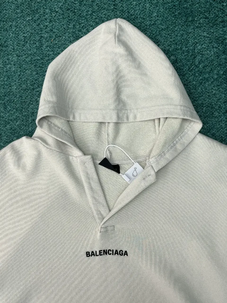 View 5 of Neutral Cotton Blend Minimalist Hoodie with Subtle Logo (Unisex)