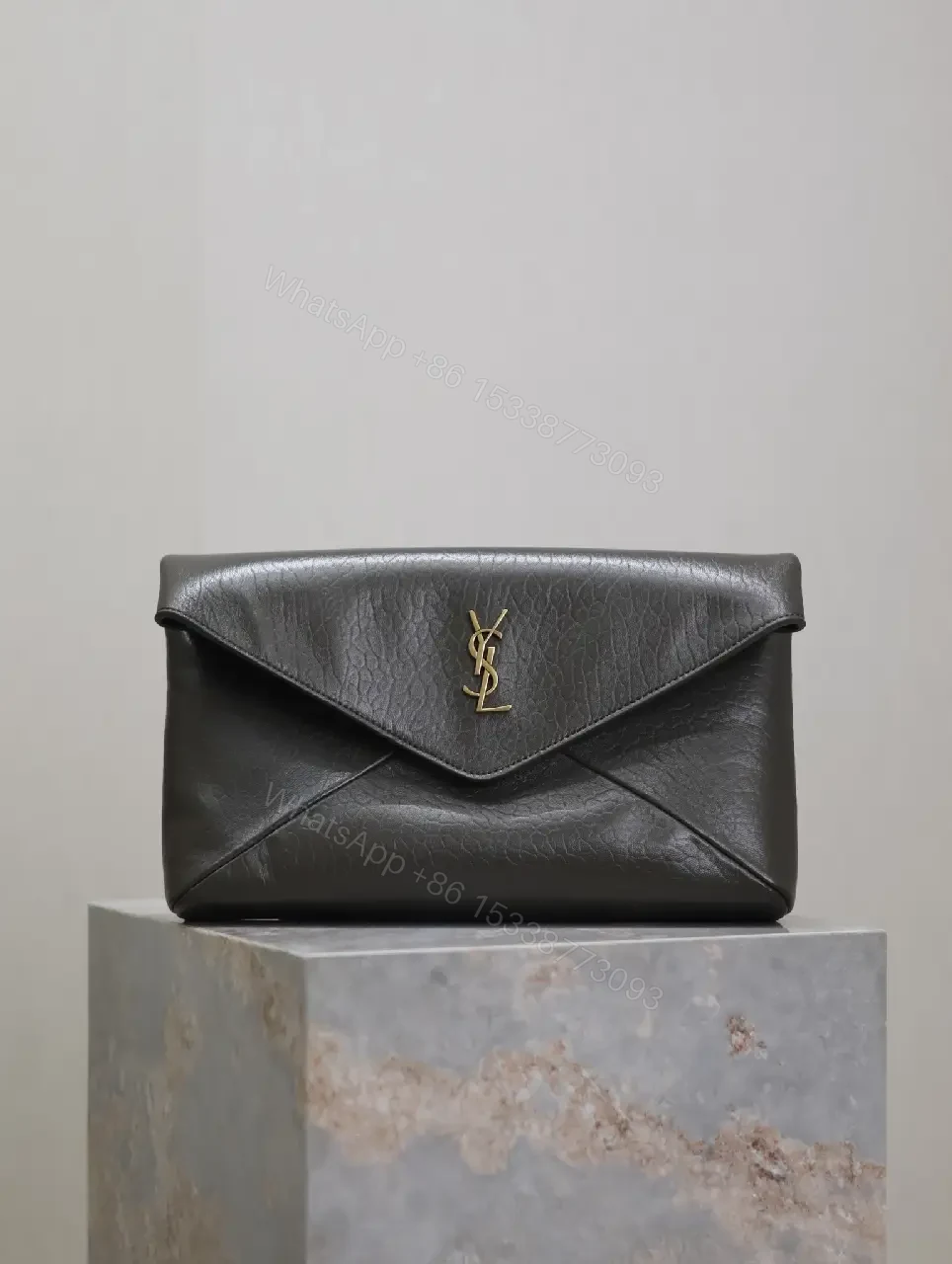 Textured Black Leather Envelope Clutch with Gold Logo Signature — view 1