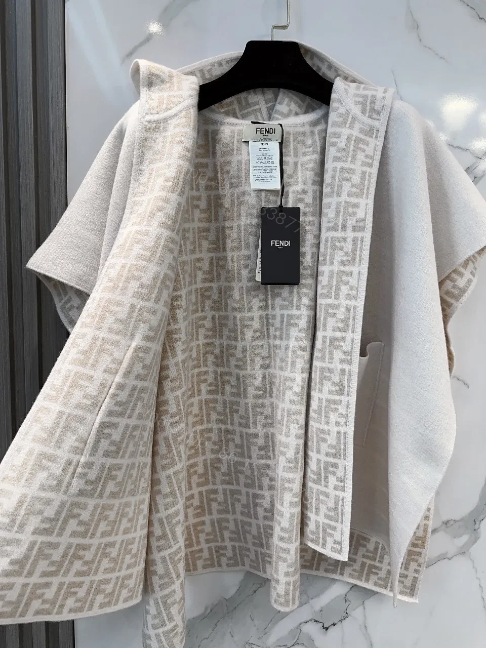 View 2 of Soft-Neutral Knit Cape Jacket: Luxury Comfort & Signature Trim