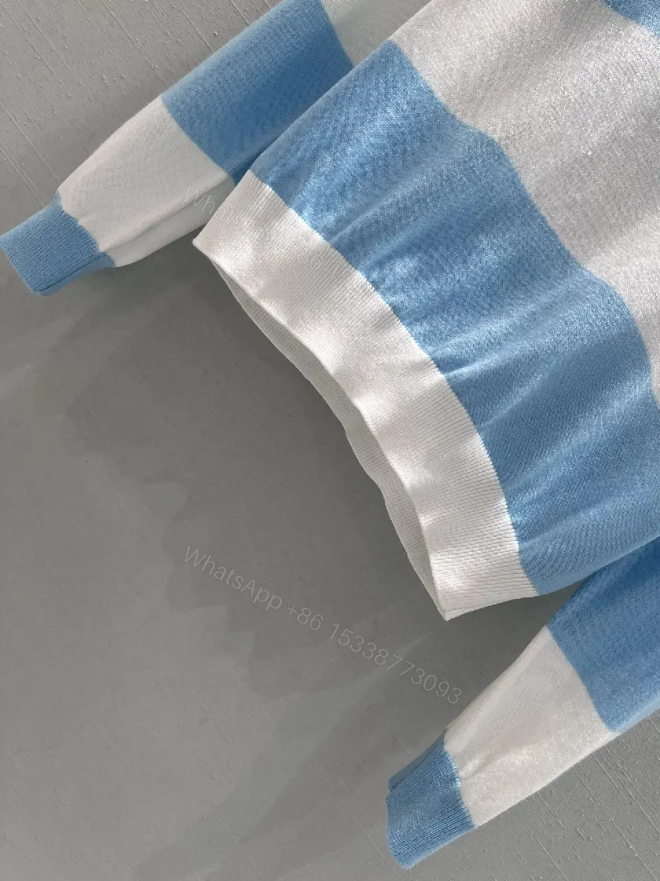 View 2 of Blue & White Striped Polo Knit with Signature Charm