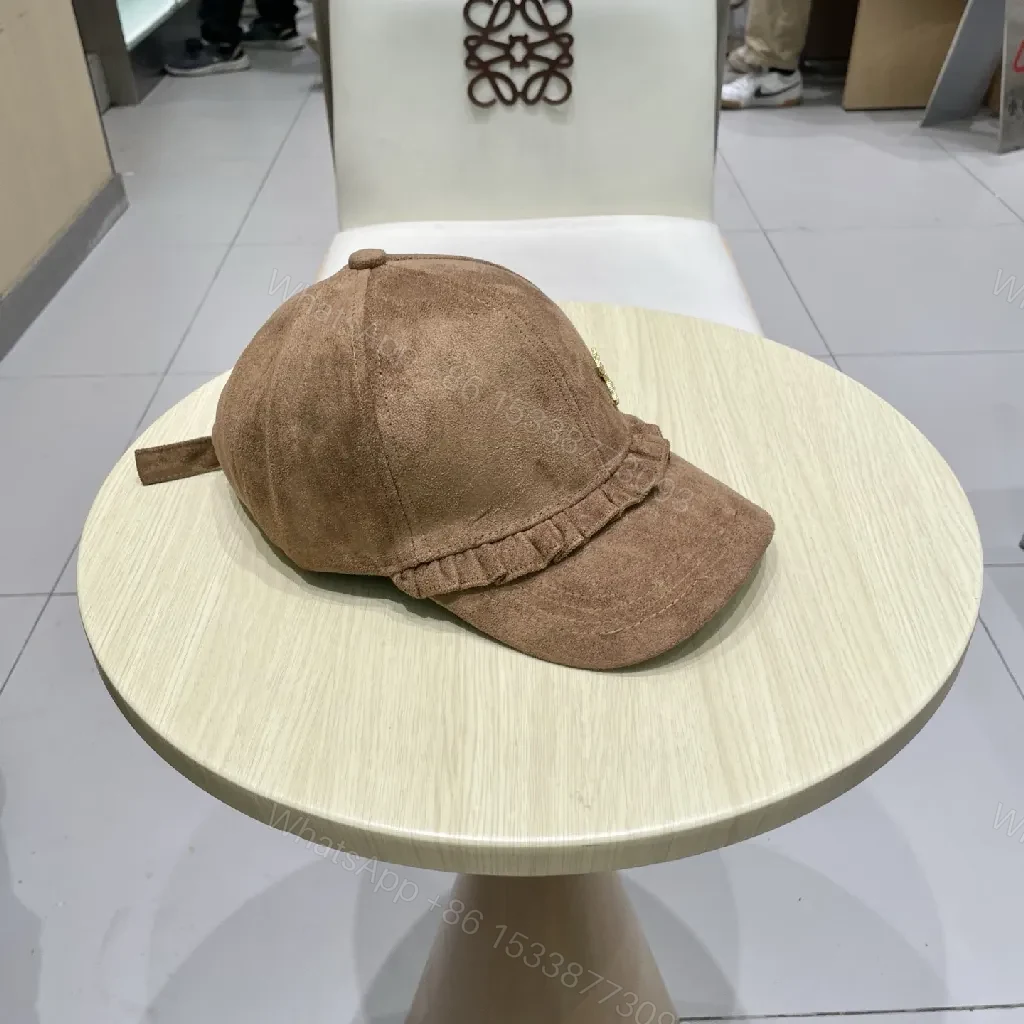View 4 of Brown Suede Cap with Gold Emblem - Textured Luxury Cap