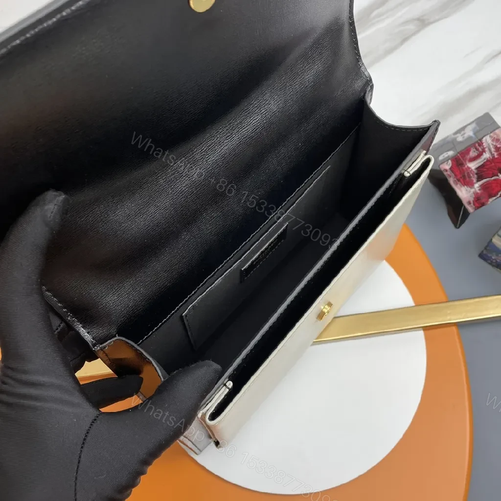View 6 of Chic Black Leather Crossbody with Gold Emblem: Compact Luxury