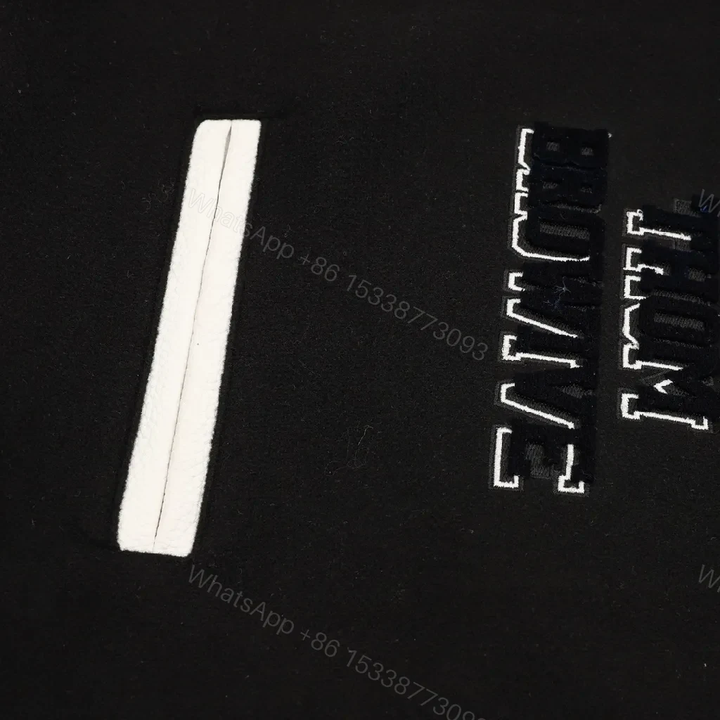 View 7 of Bold Black & Off-White Varsity Jacket with Embroidered Graffiti Details
