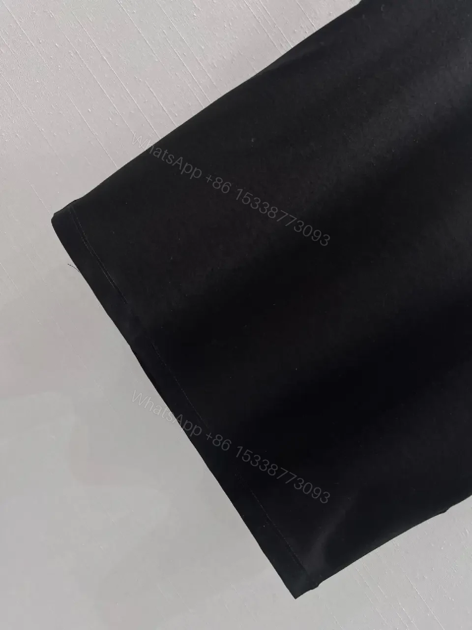 View 7 of Minimalist Black Cotton Tee with Discreet Emblem