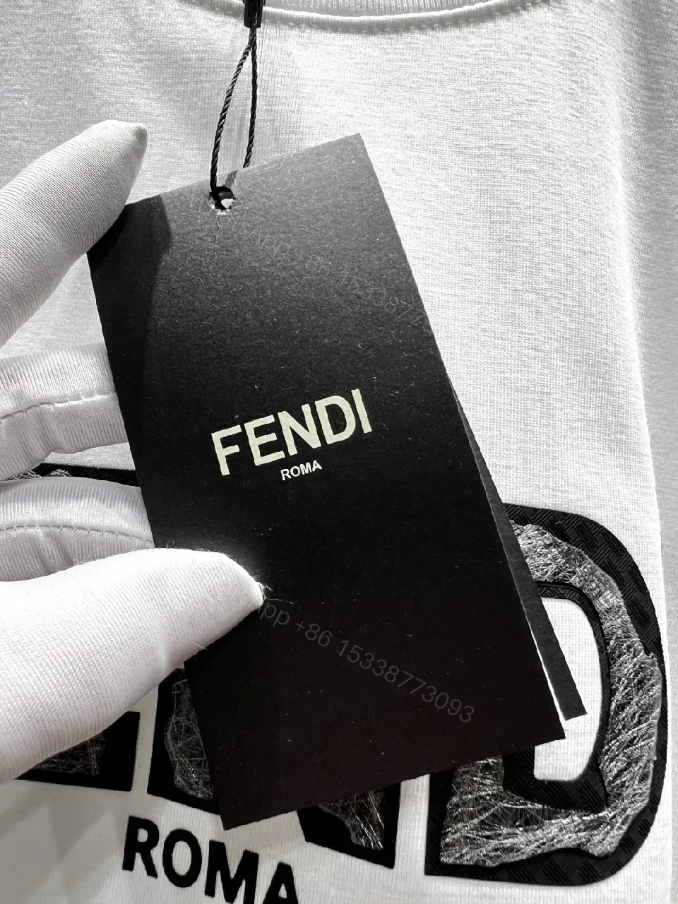View 4 of White Cotton Logo Tee - Minimalist Luxury, Relaxed Fit, Front Fendi-Inspired Emblem
