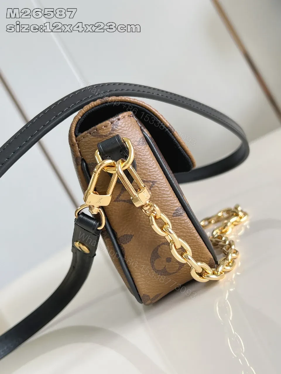View 3 of Compact Dual-Tone Monogram Messenger: Subtle Luxury Bag