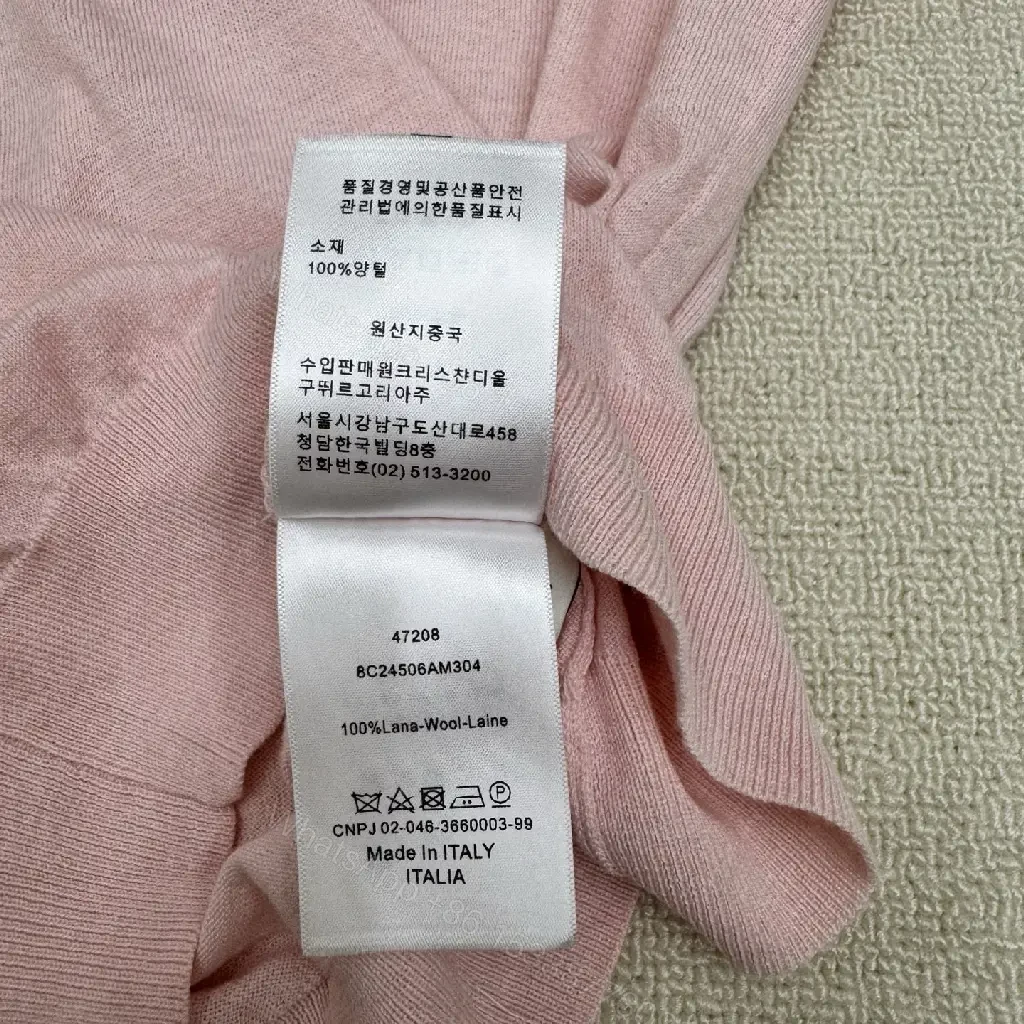 View 2 of Soft Pink Knit Top with Crest – Elegant Everyday Essential