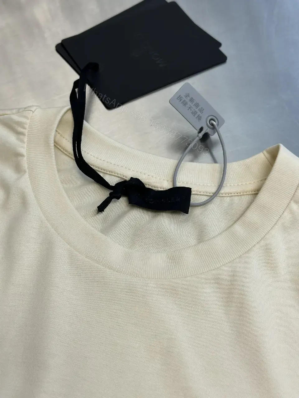 View 9 of Cream Off-White Silk-Soft Tee with Small Chest Logo Tee
