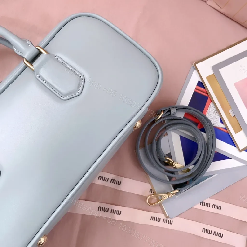 View 9 of Structured Dome Bag: Compact Luxury, Gold Accents, Versatile Style