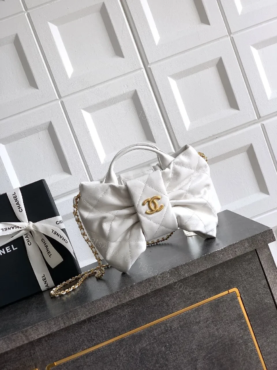 Pearl White Quilted Satin Mini Bag with Bow Detail and Gold Logo — view 1