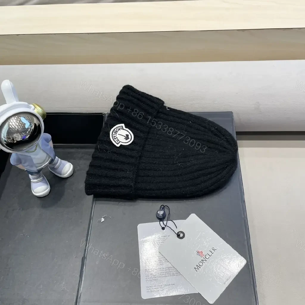 View 4 of Cozy Black Knit Beanie with Signature Patch, Luxury Style