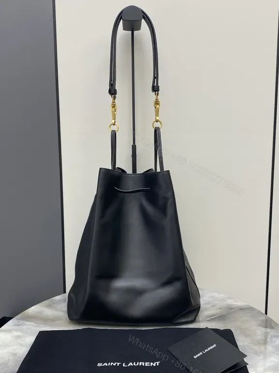 View 8 of Minimalist Black Leather Drawstring Bucket Bag with Gold Hardware
