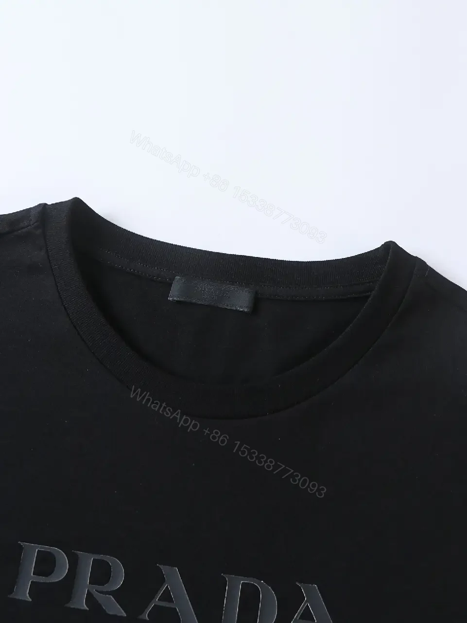 View 8 of Minimalist Black Cotton Tee: Logo-Embossed Luxury Top