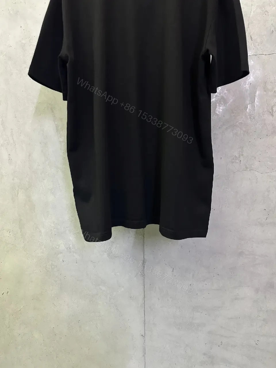 View 2 of Oversized Black Logo Cotton Tee – Modern Streetwear Essential