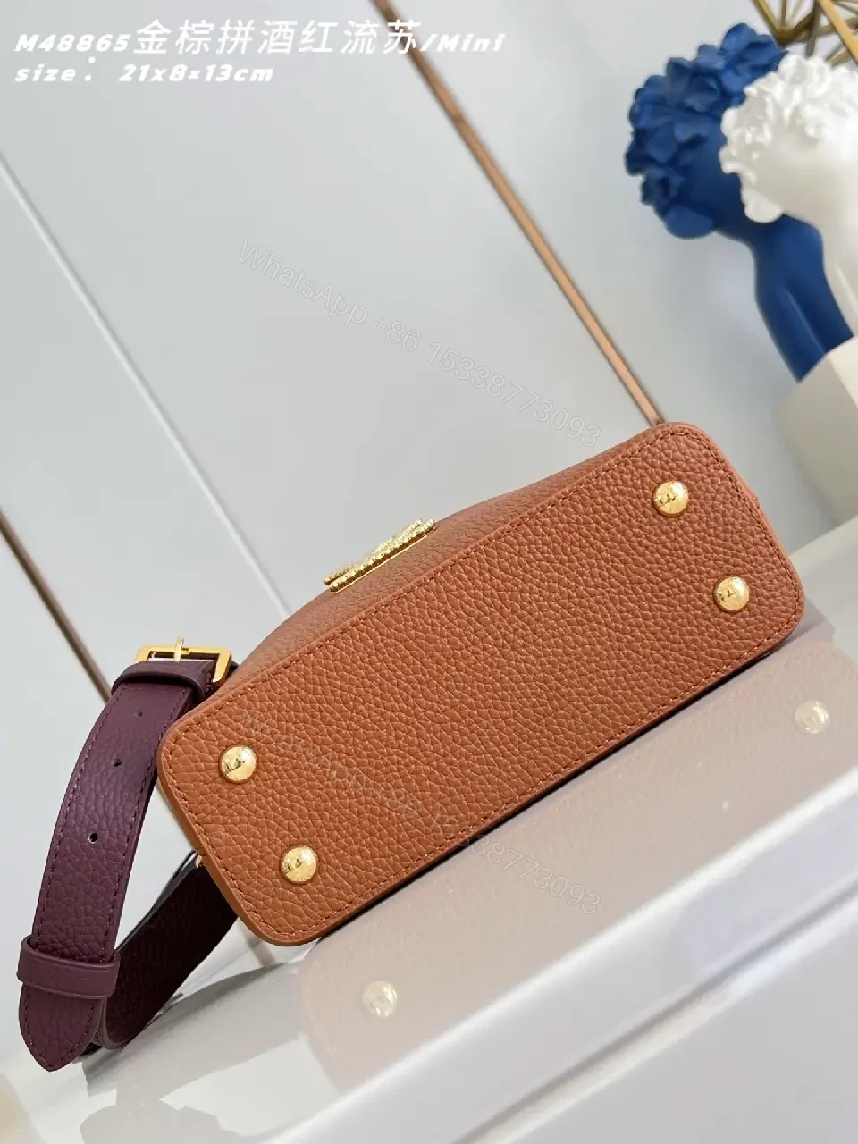 View 2 of Caramel Leather Mini Bag: Structured, Gold Emblem, Compact Luxury
