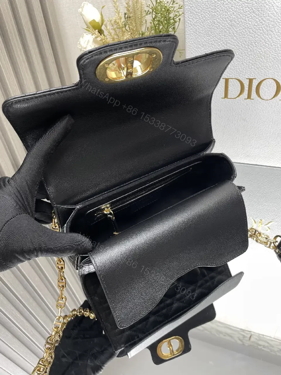 View 2 of Quilted Black Crossbody with Gold Chain: Modern Luxury Bag