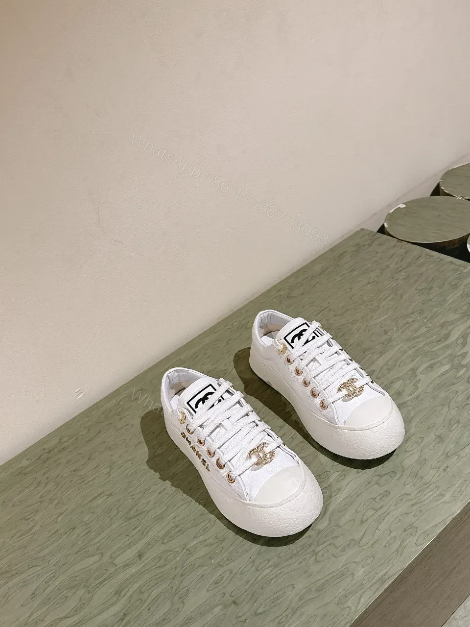 View 3 of White Leather High-Top Sneakers with Gold Accents