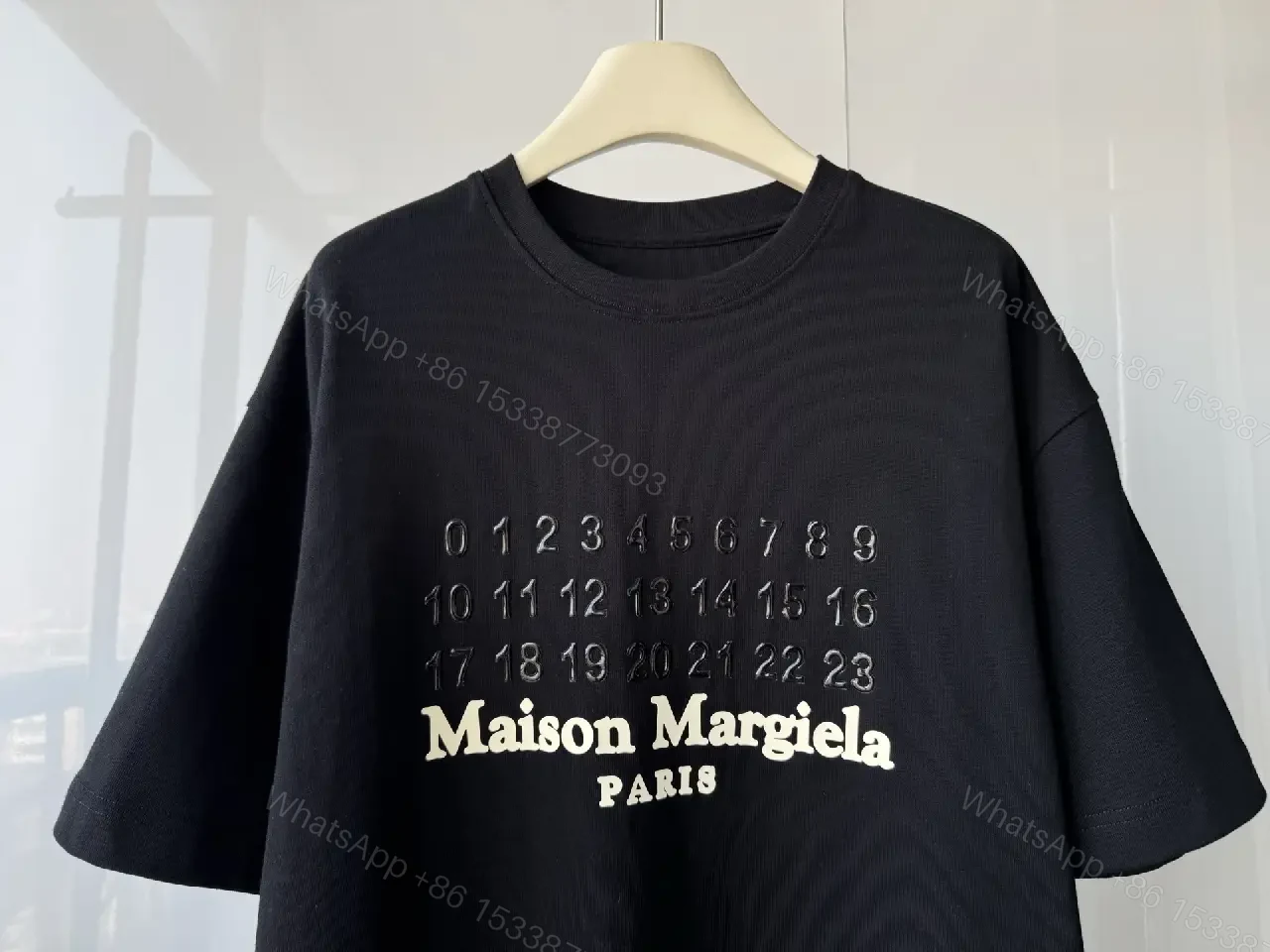 View 6 of Oversized Black Tee with Embossed Numeric Grid - Modern Graphic Comfort