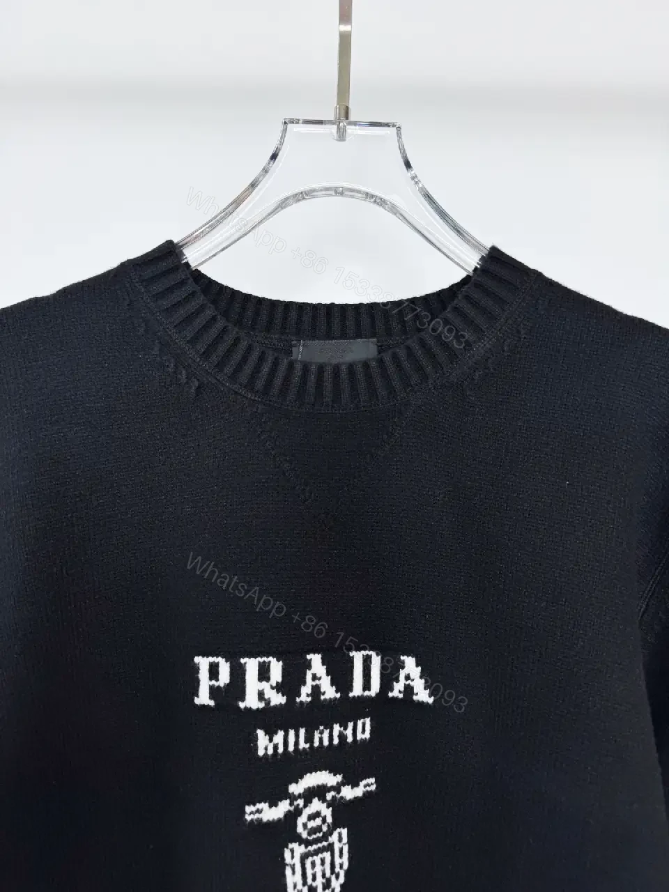 View 3 of Black Knit Pullover with Crest – Elevated Comfort Knitwear
