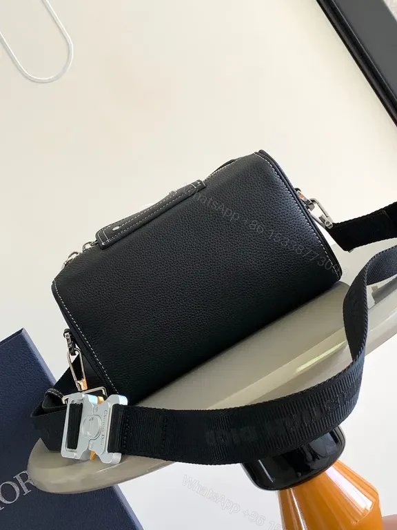 View 2 of Sleek Black Pebbled Leather Dior Crossbody Bag - Compact Couture