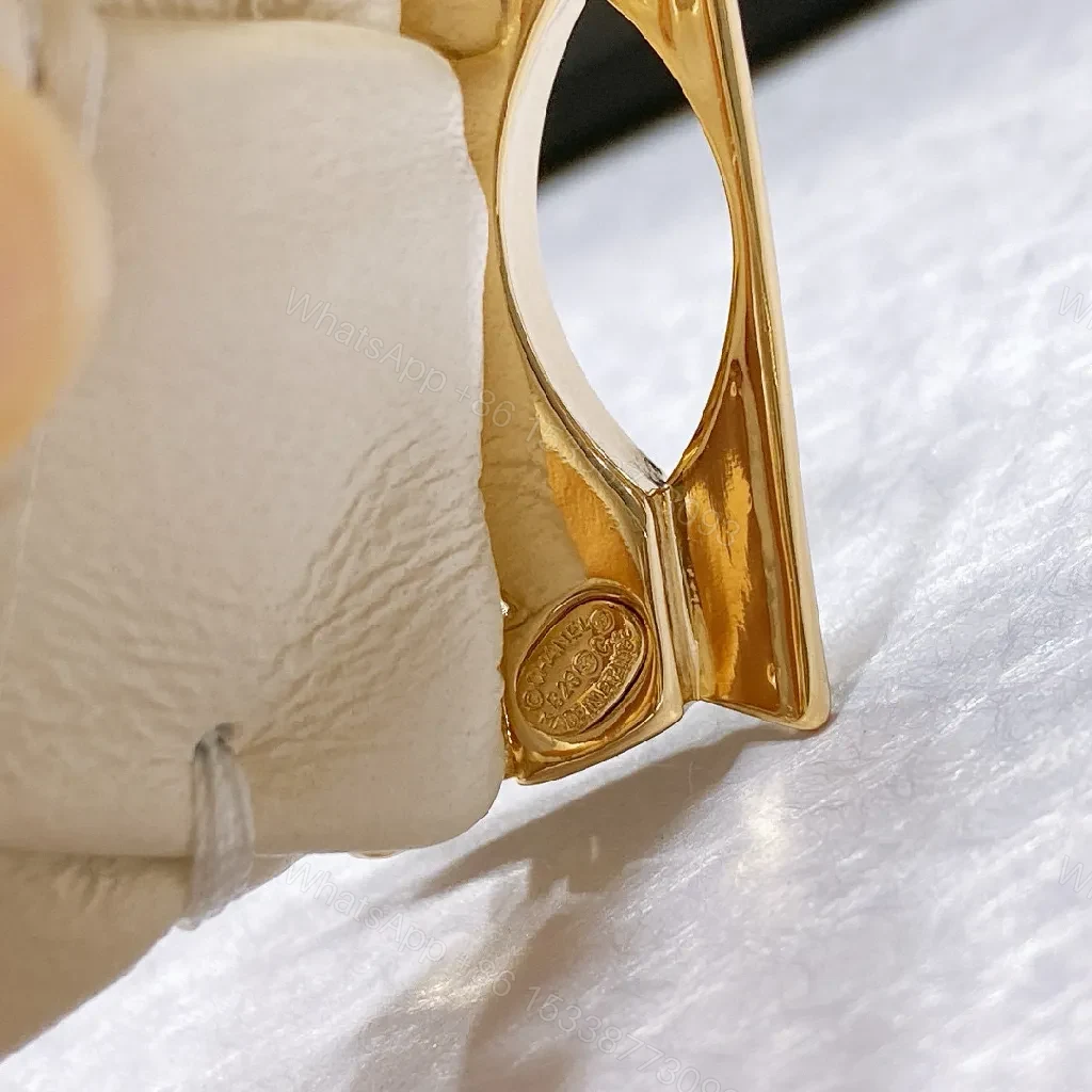 View 9 of Ivory Faux Leather Headband with Gold Logo Emblem - Chic, Everyday Glam