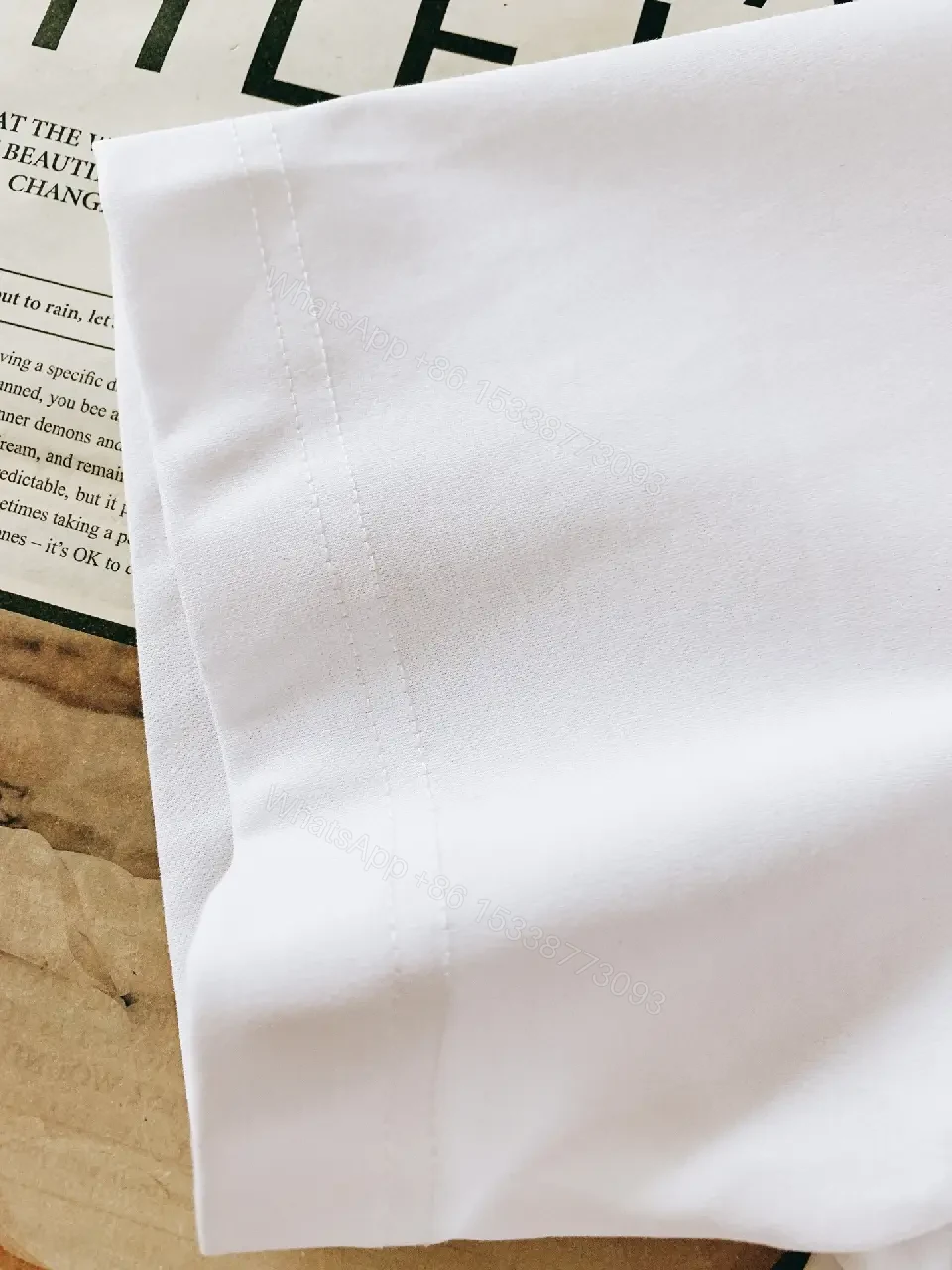 View 3 of Minimalist White Tee with Bold Orange Emblem T-Shirt