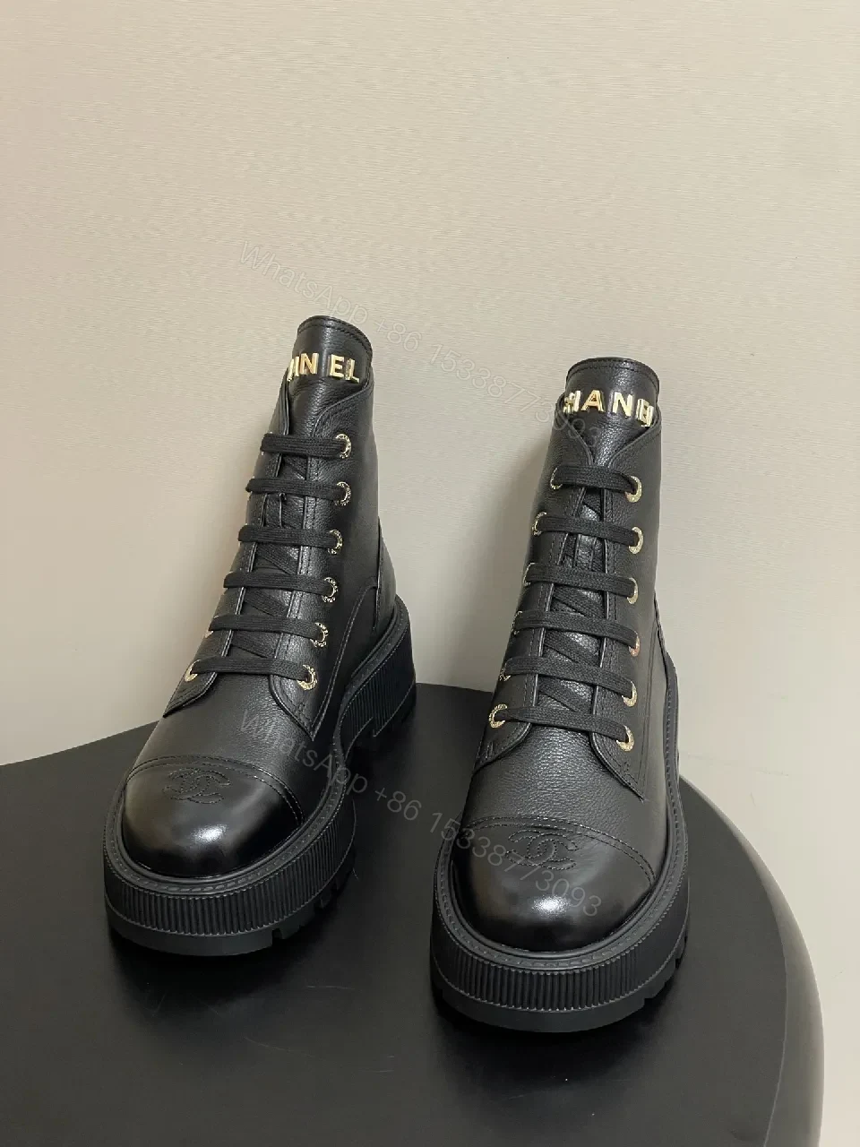 View 5 of Black Leather Combat Boots with Gold Branding Feature