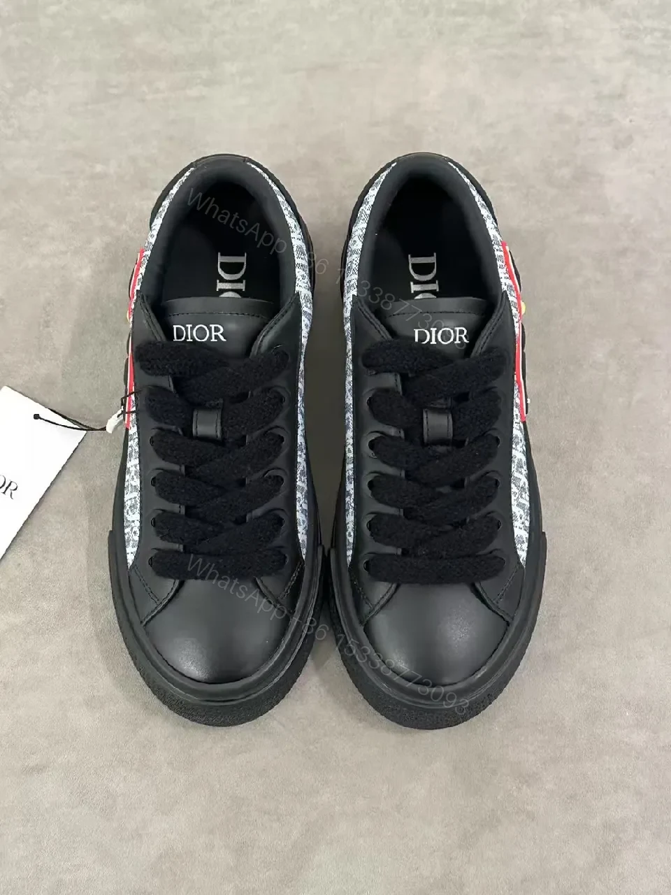 View 4 of Bold Leather High-Top Sneakers with Red Script Graphic