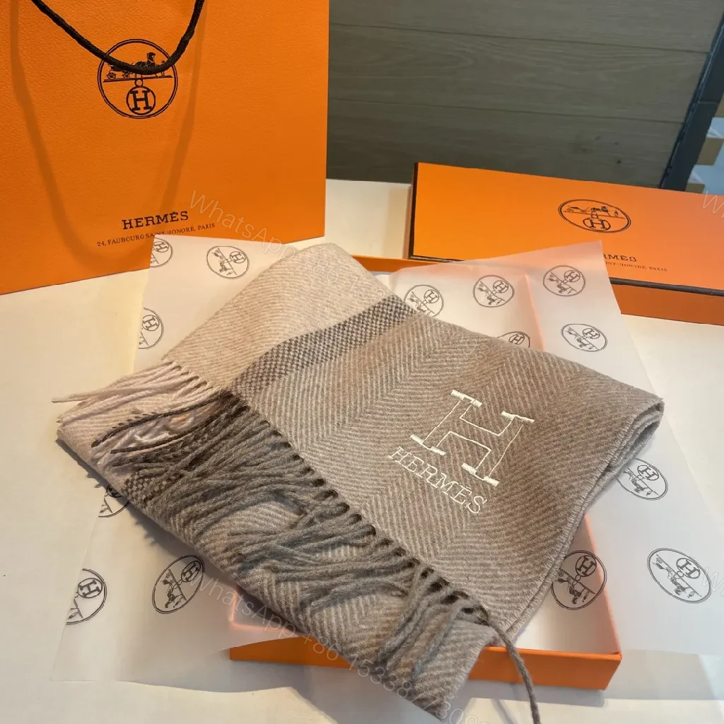 View 7 of Neutral Herringbone Knit Scarf with Subtle Emblem Detail