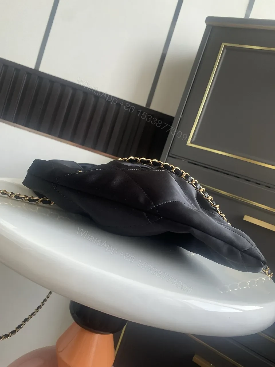 View 3 of Quilted Black Bag with Gold Emblem - Luxury Everyday Style
