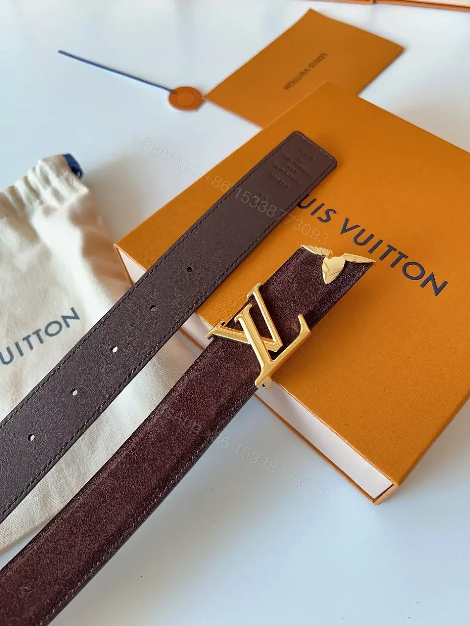 View 3 of Textured Leather Belt with Gold LV Buckle - Luxury Accessory Belt