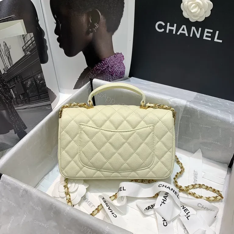 View 5 of Compact Quilted Handbag with Gold Chain Strap - Timeless Luxury