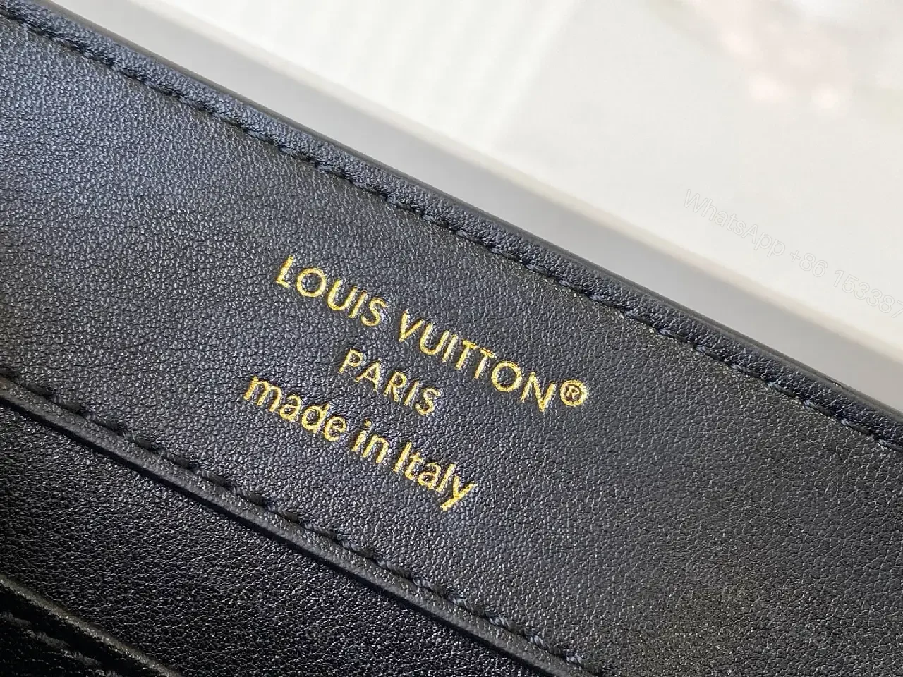 View 6 of Compact Black Pebble-Grain Top-Handle Bag with Gold Hardware