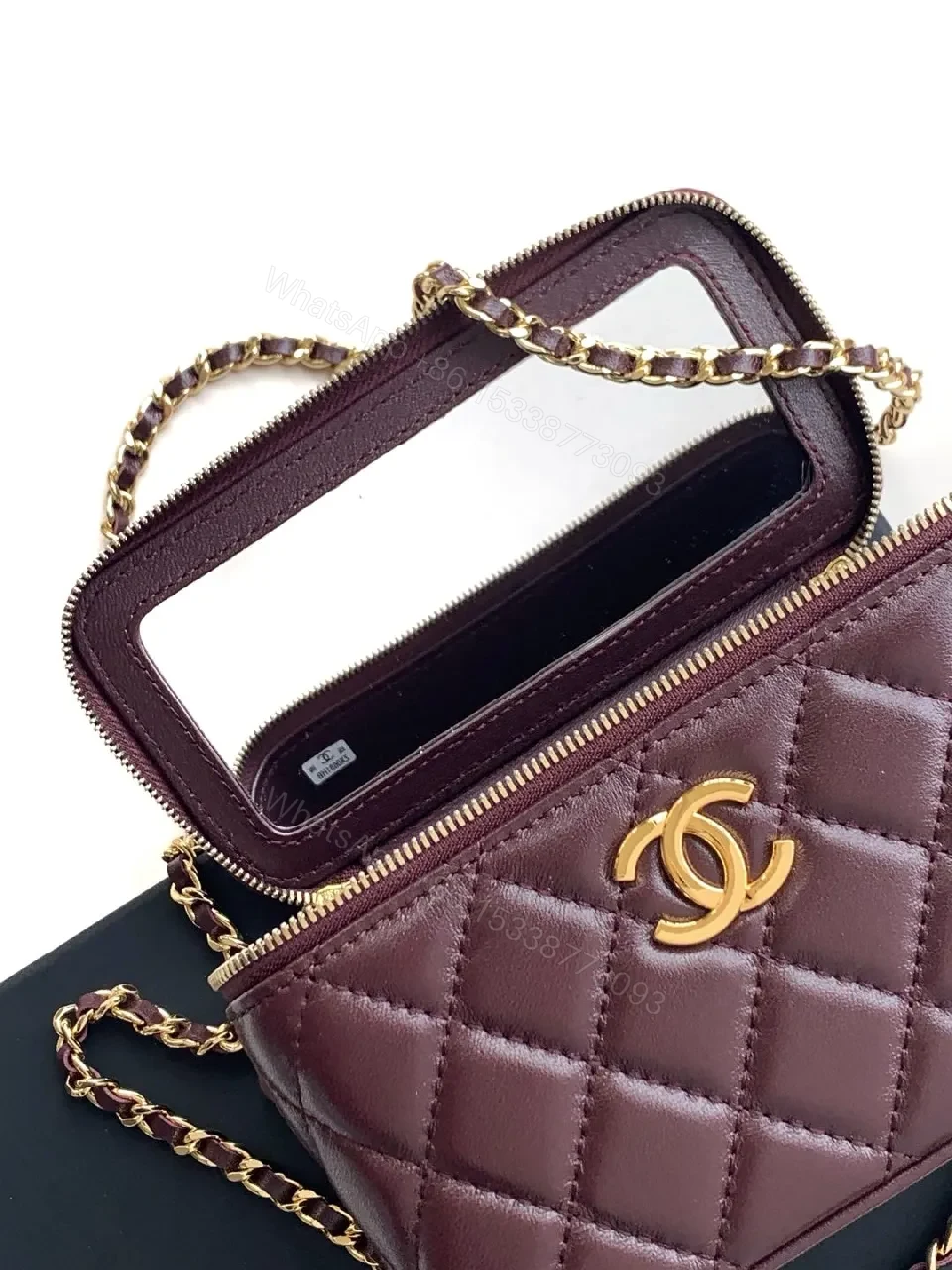 View 8 of Quilted Burgundy Bag with Gold Chain Handle—Compact Luxury