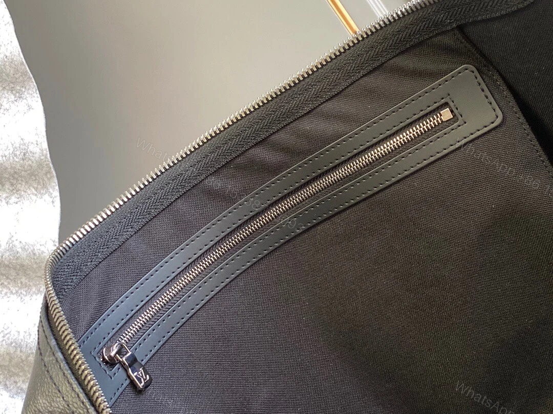 View 9 of SUMMER SET: LOUIS VUITTON KEEPALL BANDOULIÈRE 50 MONOGRAM ECLIPSE & LONG WALLET MONOGRAM ECLIPSE TRUNK ZIPPY BLACK 19CM