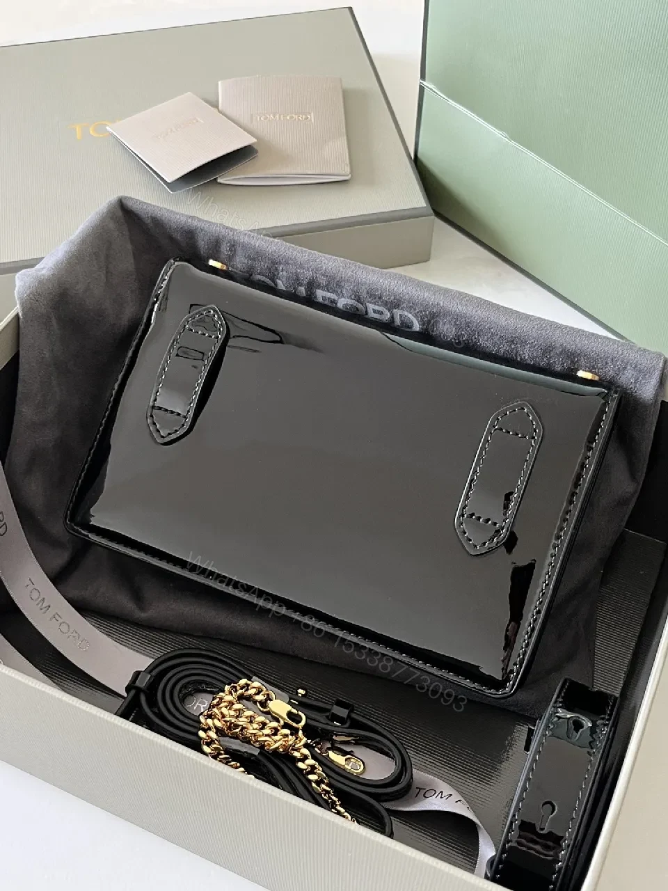 View 7 of Compact Black Leather Crossbody with Gold TF Emblem