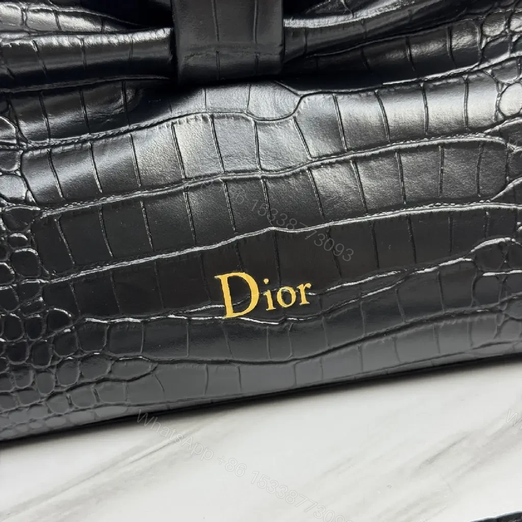 View 7 of Croc-Texture Bow Clutch: Leather Luxury, All-Day Glam