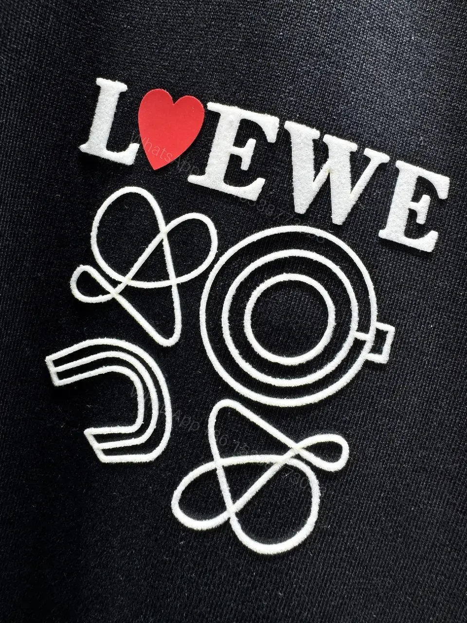 View 2 of Black Cotton Tee with Subtle Embroidered Graphic, Minimal Luxury, Everyday Wear