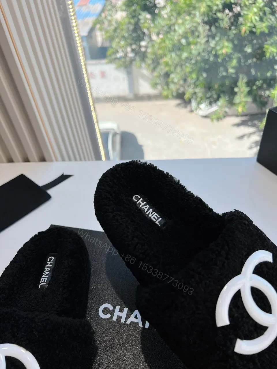 View 7 of Cozy Black Plush Slippers with Logo Detail