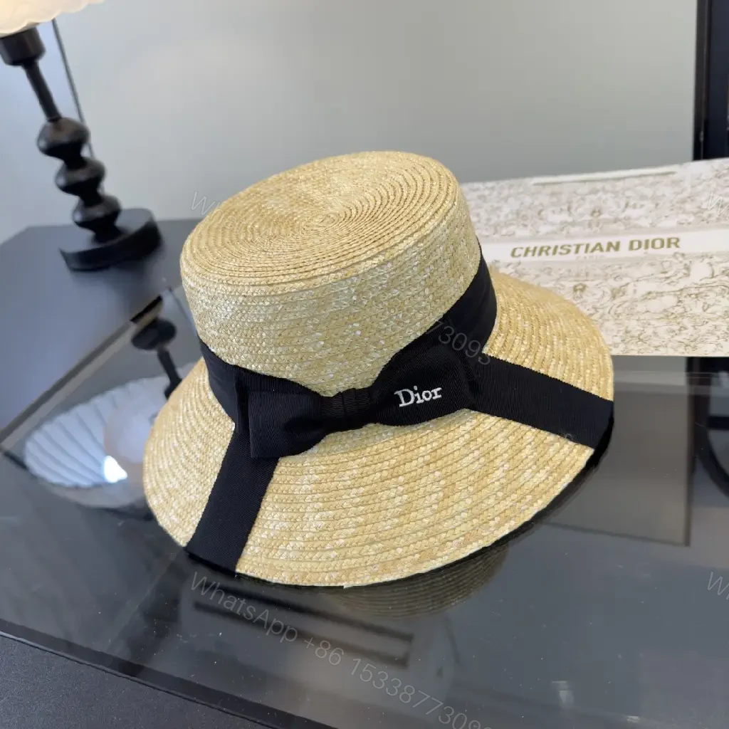 View 4 of Natural Straw Wide-Brim Hat with Black Ribbon Accent