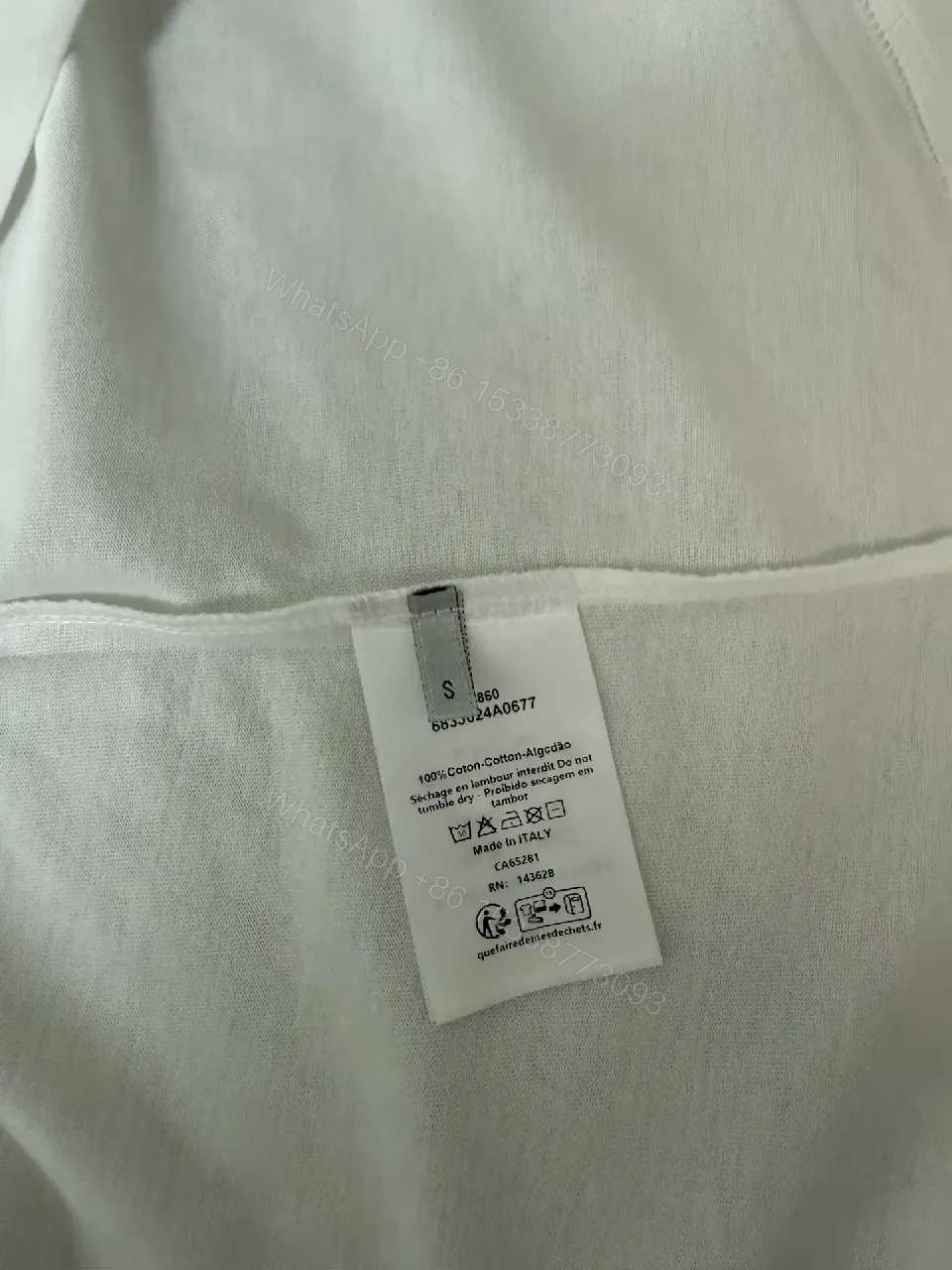 View 2 of Minimalist White Cotton Tee with Subtle Logo