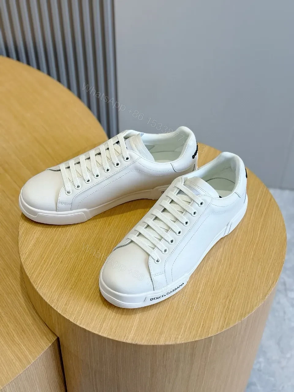 Minimal White Leather Sneakers with Subtle Designer Detailing — view 1