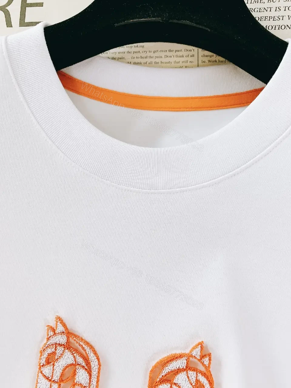 View 9 of Minimalist White Tee with Bold Orange Emblem T-Shirt