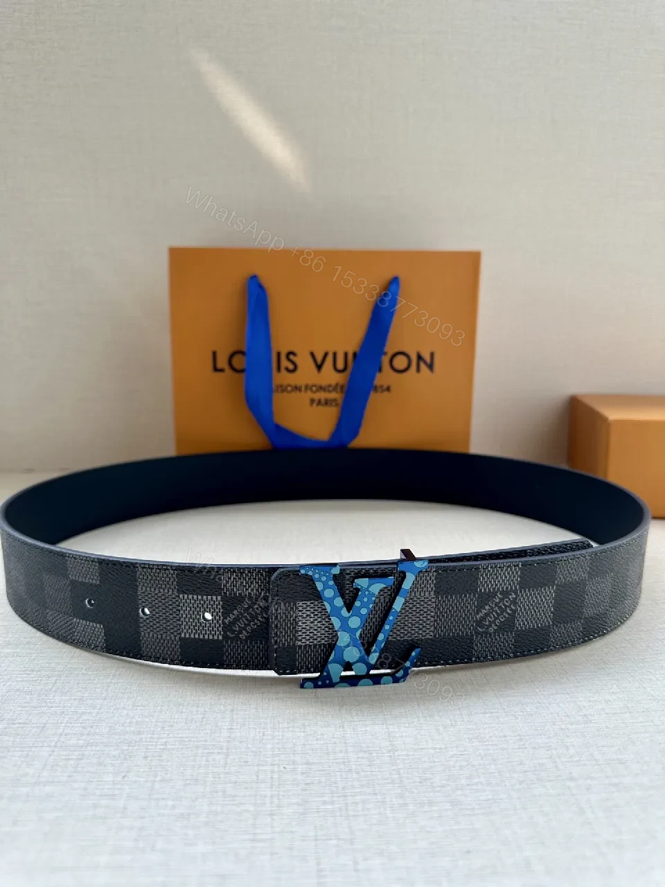Bold Checker Belt with Blue Buckle — Modern Luxury Accessory — view 1