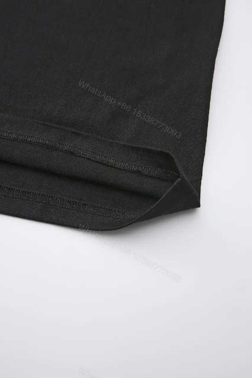 View 6 of Minimalist Black Cotton Tee with Subtle Embossed Logo - T‐Shirt