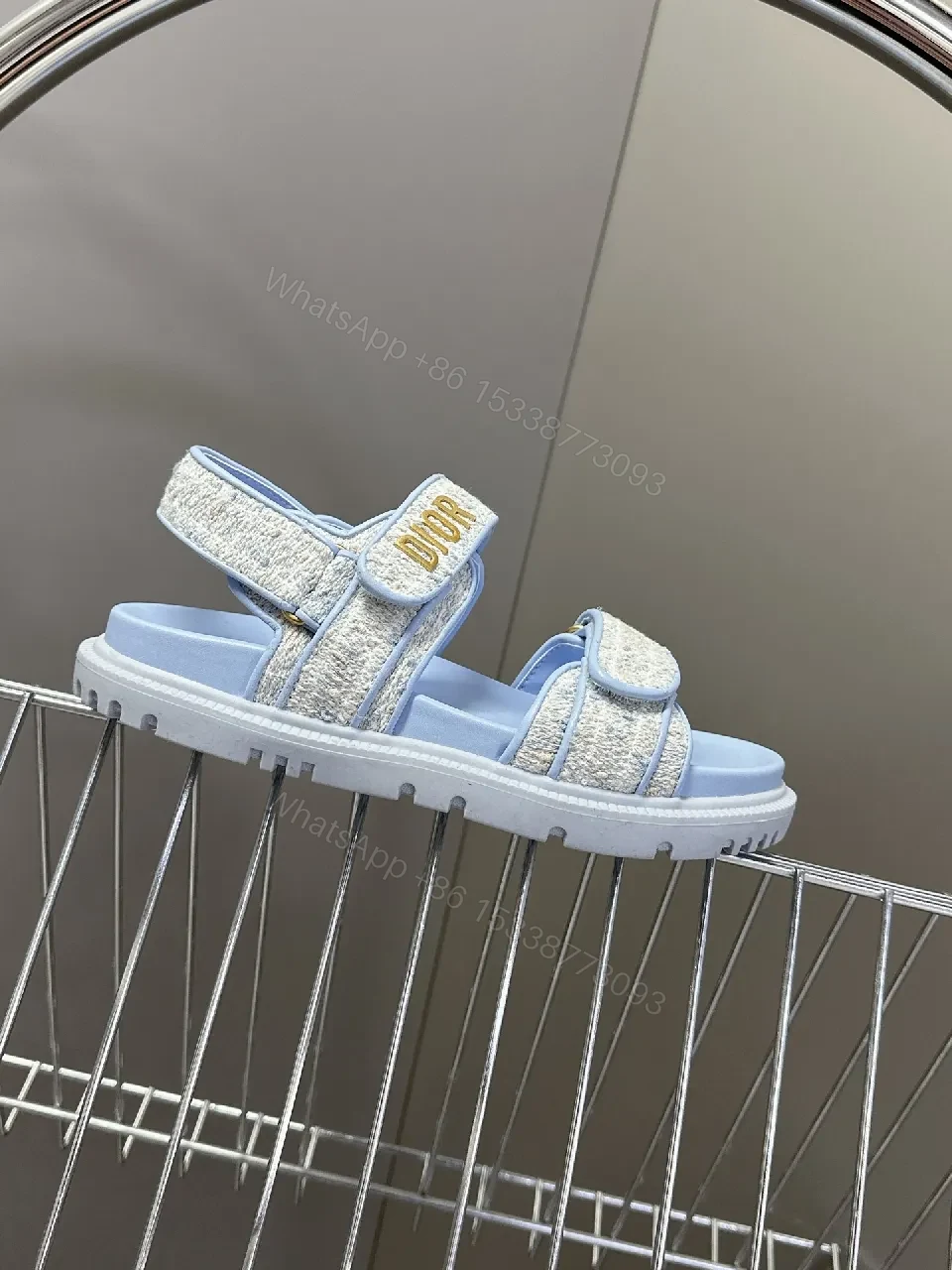 View 2 of Soft-Gleam Crest Sandals: Light-Blue Textured Straps, Minimal Logo